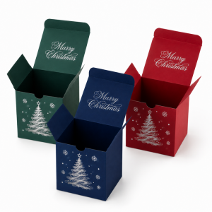 Open flip top tuck style Christmas gift boxes in green, red, and navy blue, featuring “Merry Christmas” print and holiday tree design, premium custom candle packaging boxes for wholesale and branded seasonal gift packaging.