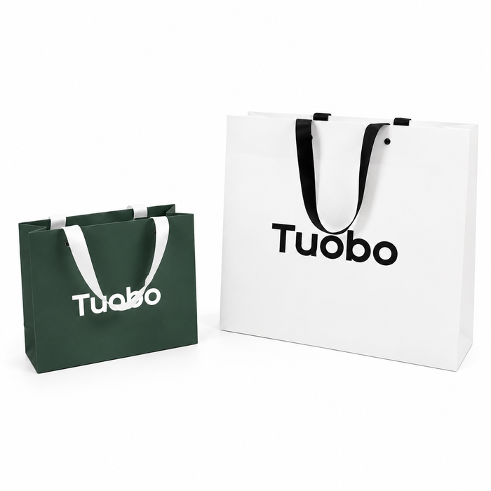 Custom paper bags with logo featuring matte white card paper and dark green shopping bags, designed for retail brands, boutiques, and custom packaging solutions.