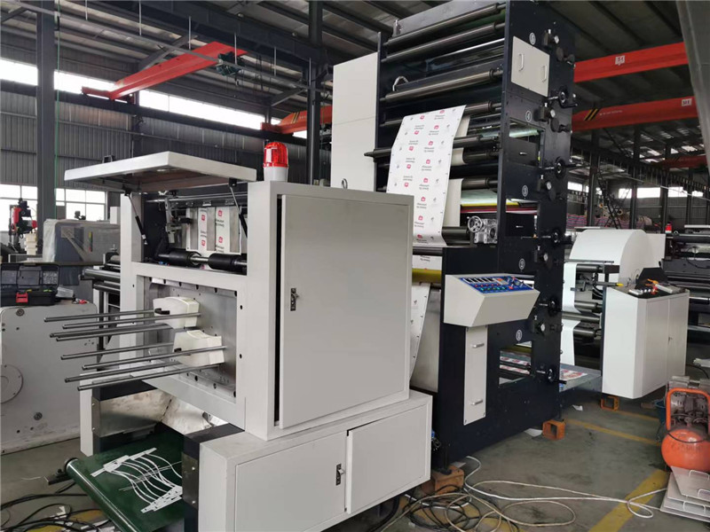 Industrial automatic printing machine operating in a factory production workshop for manufacturing custom paper cups and eco friendly packaging products.
