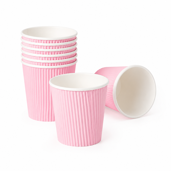 Product group shot stacked pink vertical ripple wall paper cups with one laid flat showing inner liner, pure white background, 8K commercial product photography, blank custom printable insulated corrugated espresso paper cups for restaurant cafe bulk order