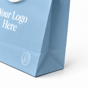 Close up of blue custom paper shopping bag bottom gusset corner with durable folded structure