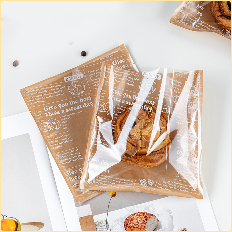 Eco kraft printed bagel bags with transparent window, loaded with almond croissant, great to make a bag full of bagels and baked treats for bakery shop display