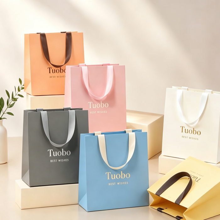 Custom Tuobo gift bags in vibrant colors, wholesale paper shopping bags with printed logo for retail and gifting use
